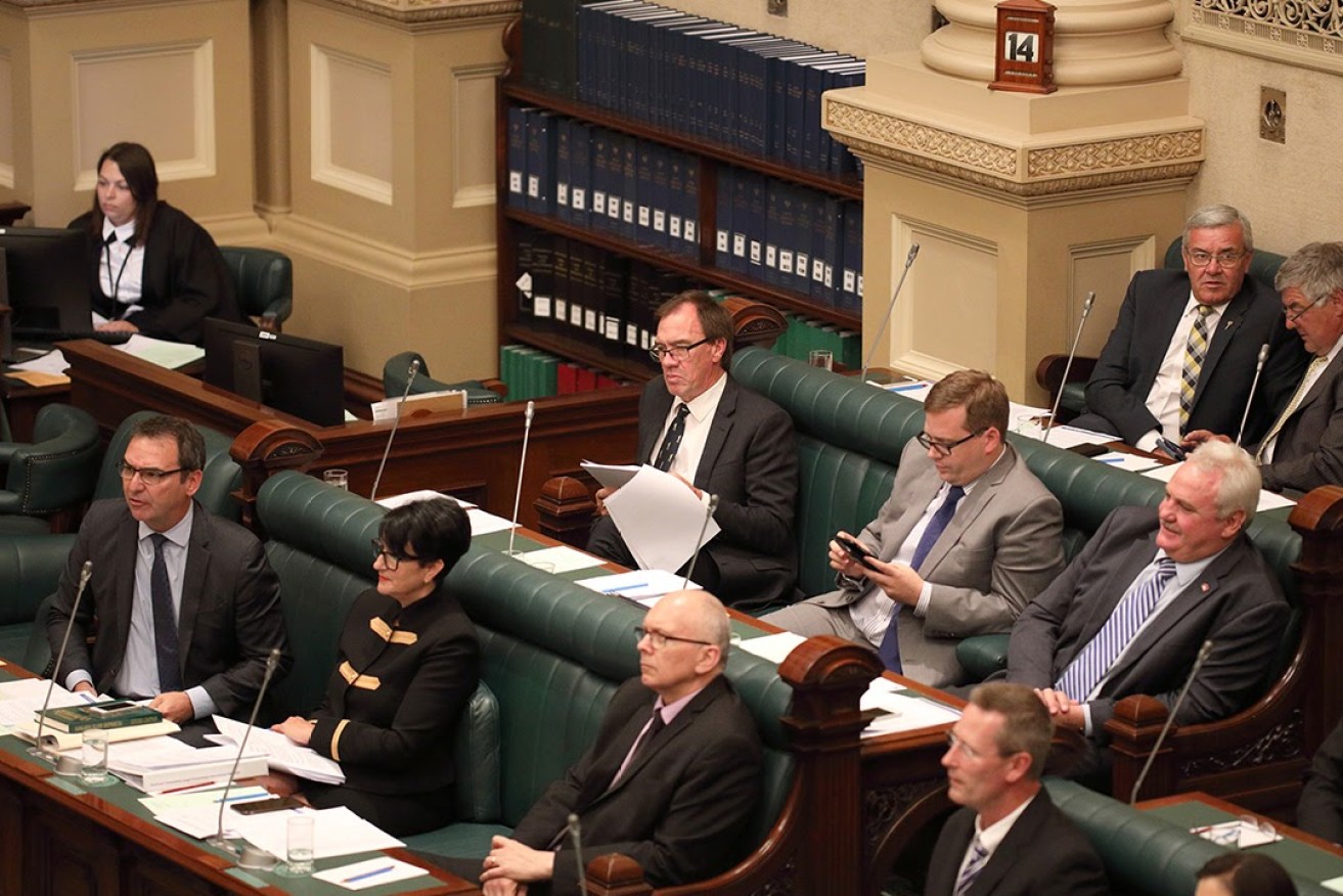 Liberal deputy leader Vickie Chapman surrounded by male colleagues. Photo: Tony Lewis / InDaily