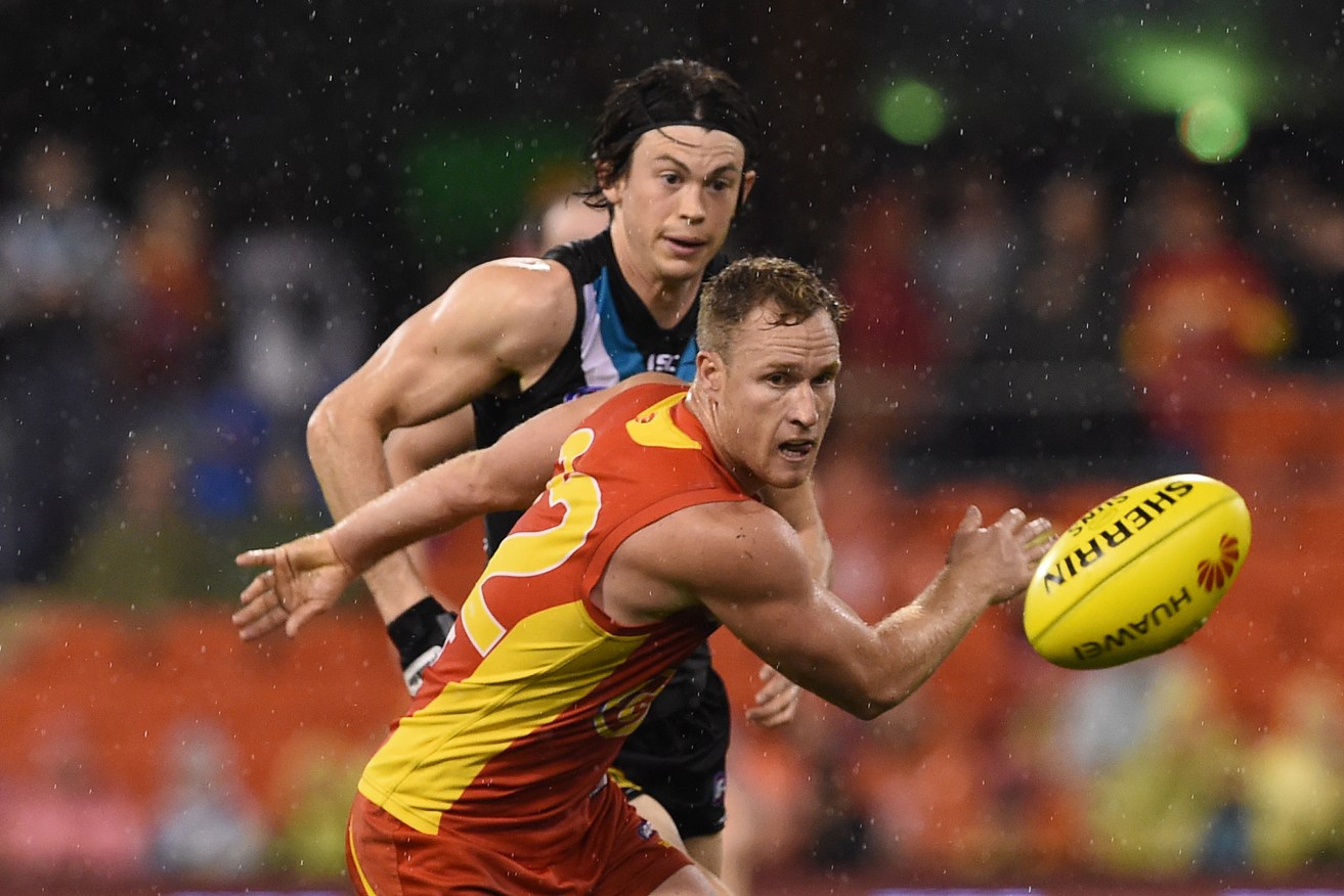 SEEING RED: The Suns have come out in front in the battle of the jumpers. Photo: Dave Hunt / AAP