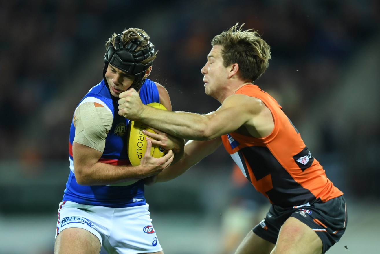 Toby Greene of the Giants has been banned for striking Bulldog Caleb Daniel on Friday night. Photo: Lukas Coch / AAP