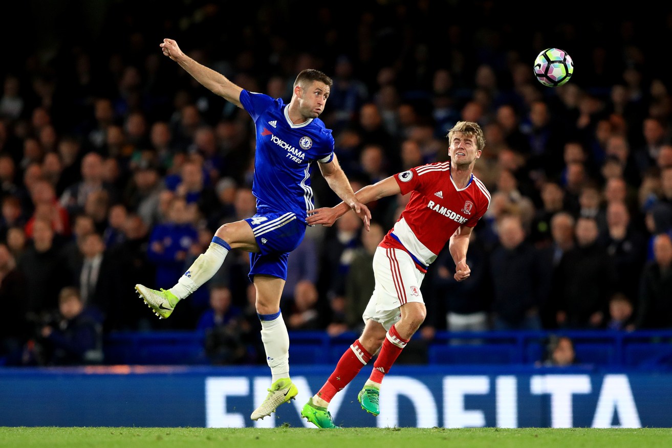 Chelsea's Gary Cahill and Middlesbrough's Patrick Bamford battle for the ball.