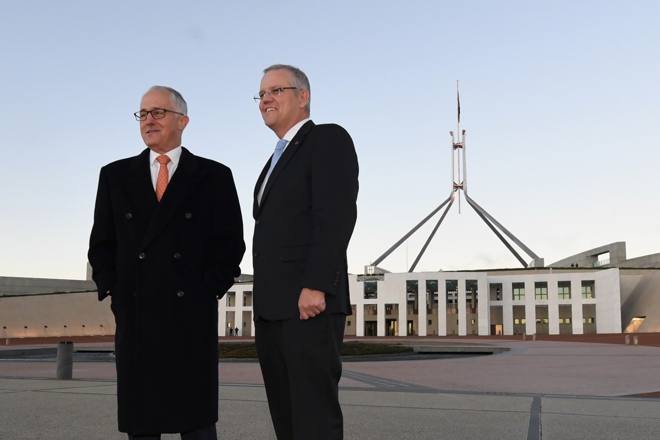 Prime Minister Malcolm Turnbull (left) and Treasurer Scott Morrison selling the budget outside Parliament House. Photo: AAP/Lukas Coch