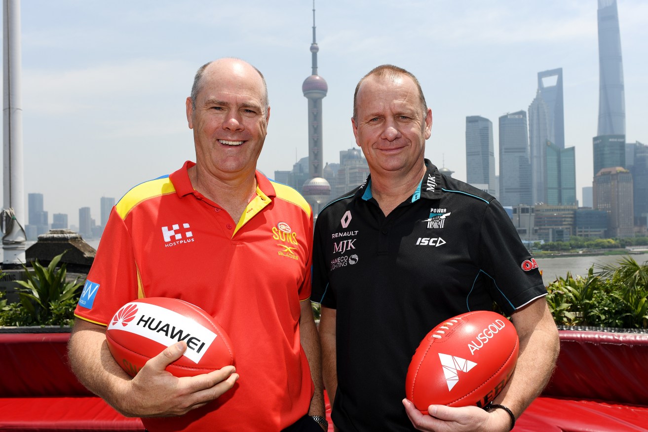 Suns coach Rodney Eade and Power coach Ken Hinkley at a Bar Rouge media call in Shanghai. Photo: Tracey Nearmy / AAP