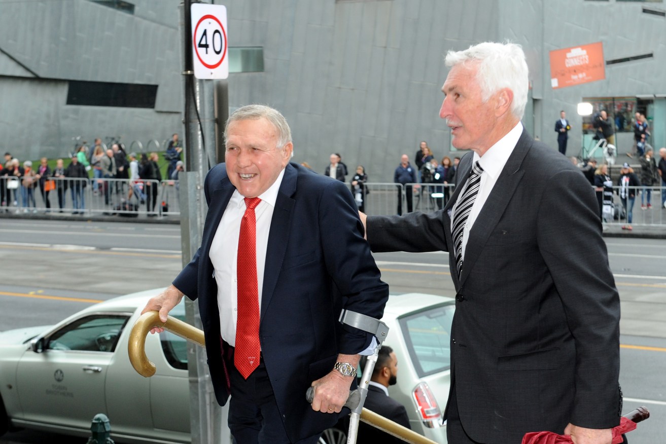 Legendary South Melbourne player Bob Skilton and former Collingwood coach Mick Malthouse arrive at St Paul's Cathedral for Lou Richards' state funeral. Photo: Joe Castro / AAP