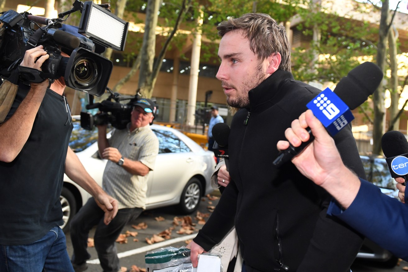Adam Cranston leaves the Sydney Police Centre in Surry Hills, Sydney yesterday. The son of ATO deputy commissioner Michael Cranston is one of nine people charged after the AFP cracked a major conspiracy to defraud taxpayers of at least $165 million by running a payroll scam out of Sydney. Photo: AAP
