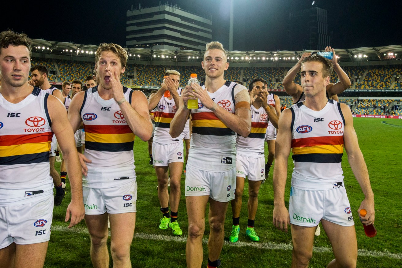 Debutants Jordan Gallucci (right) and Hugh Greenwood - Fumbles' new Favourite Person Ever - leave the field with milestone men Luke Brown and Rory Sloane after beating Brisbane. Photo: Glenn Hunt / AAP