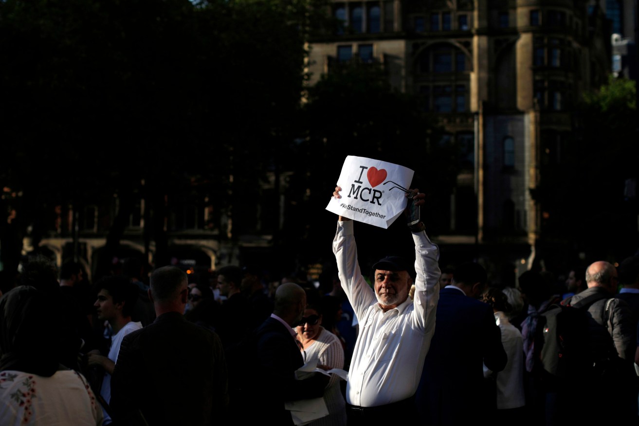 People attend a vigil in Albert Square, Manchester, the day after the suicide attack at an Ariana Grande concert. Photo: AP/Emilio Morenatti