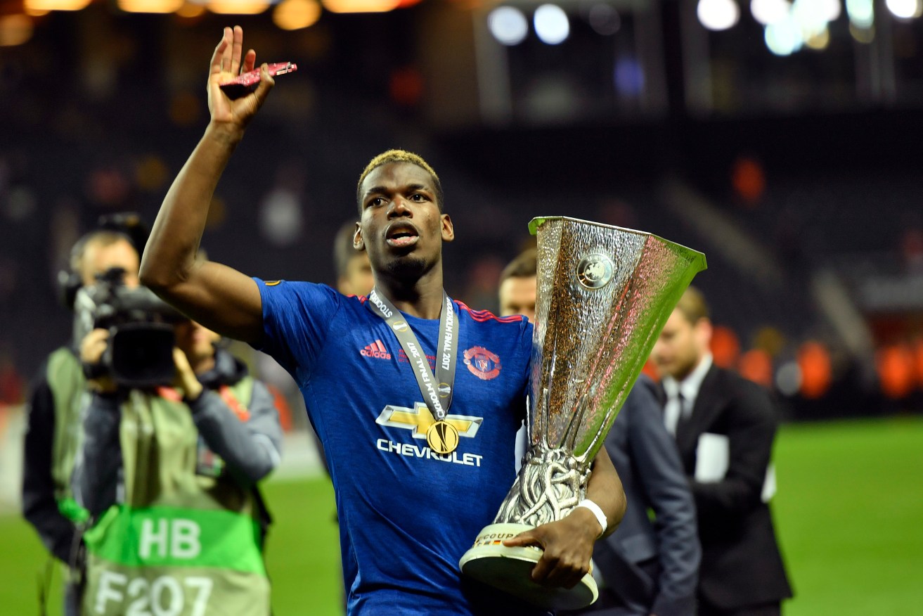 United's Paul Pogba holds the trophy after the Europa League final. Photo: Martin Meissner / AP