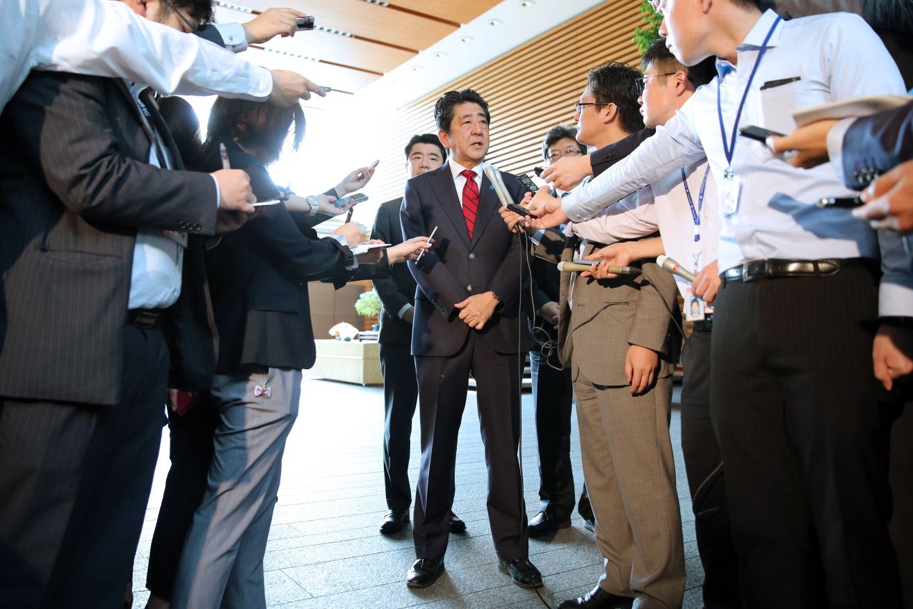 Japanese Prime Minister Shinzo Abe speaks to media about the ballistic missile from North Korea landed in the waters of Japan's economic zone. Photo: The Yomiuri Shimbun via AP