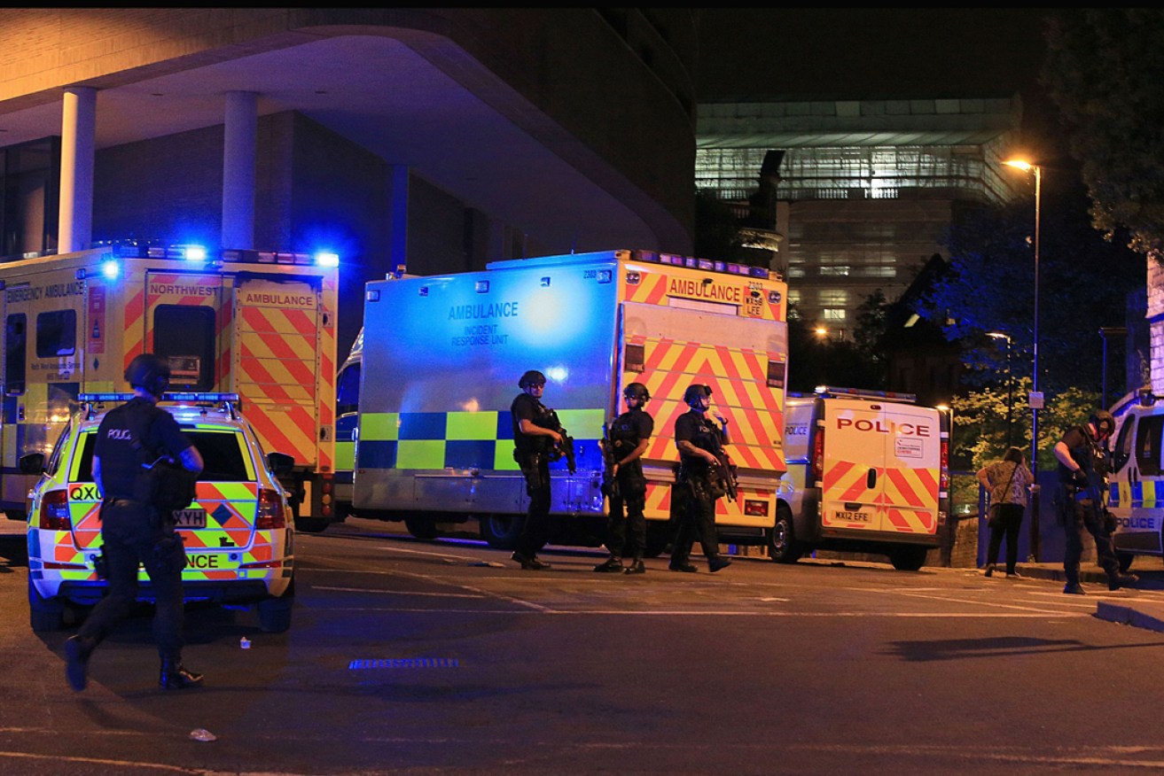 Armed police at Manchester Arena after reports of an explosion during an Ariana Grande gig. Photo: PA Wire