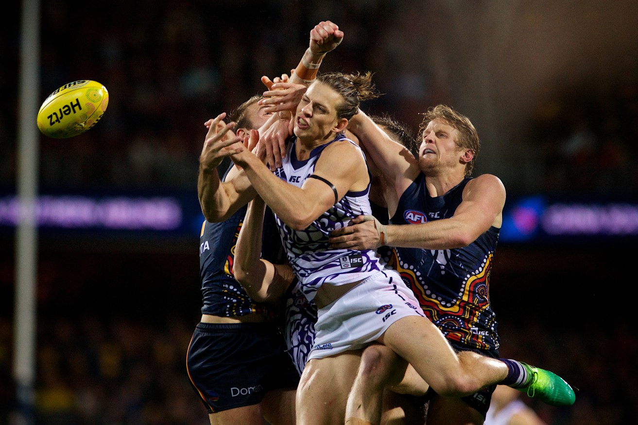 Rory Sloane (right, spoiling Docker Nat Fyfe) will receive close attention from tagger Scott Selwood on Friday night. Photo: Michael Errey / InDaily
