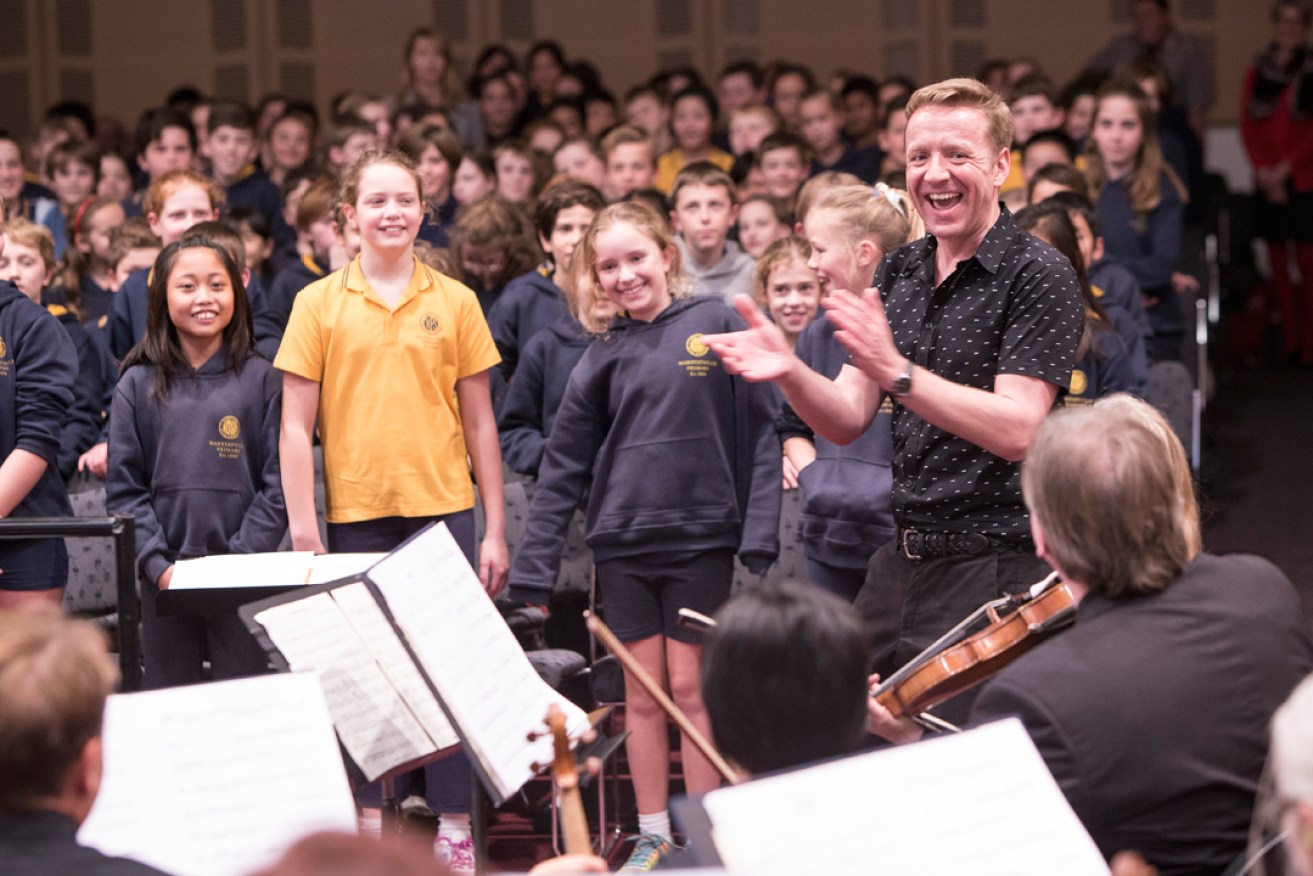 Composer and music educator Paul Rissmann with young musicians.