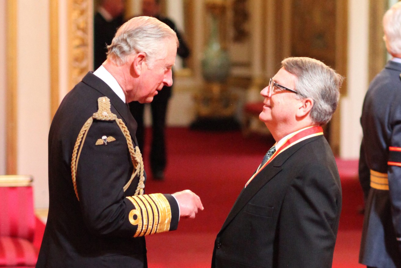 SA-born pollster and campaign guru Lynton Crosby receiving his Knight Bachelor of the British Empire from Prince Charles in May 2016 for his services to politics. Photo: Anthony Devlin / PA Wire