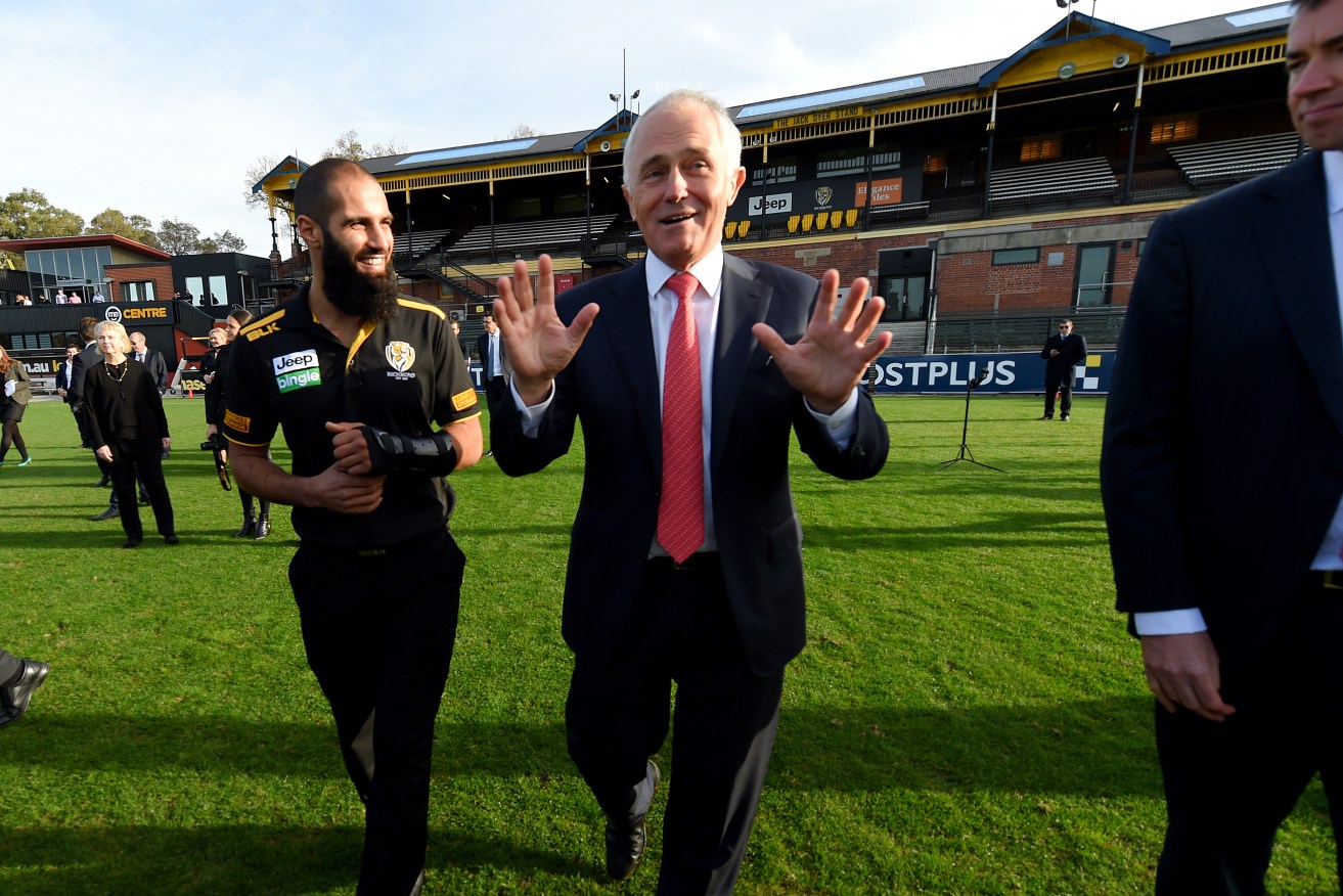 Prime Minister Malcolm Turnbull with Richmond defender Bachar Houli during a visit to the club. Photo: Tracey Nearmy / AAP