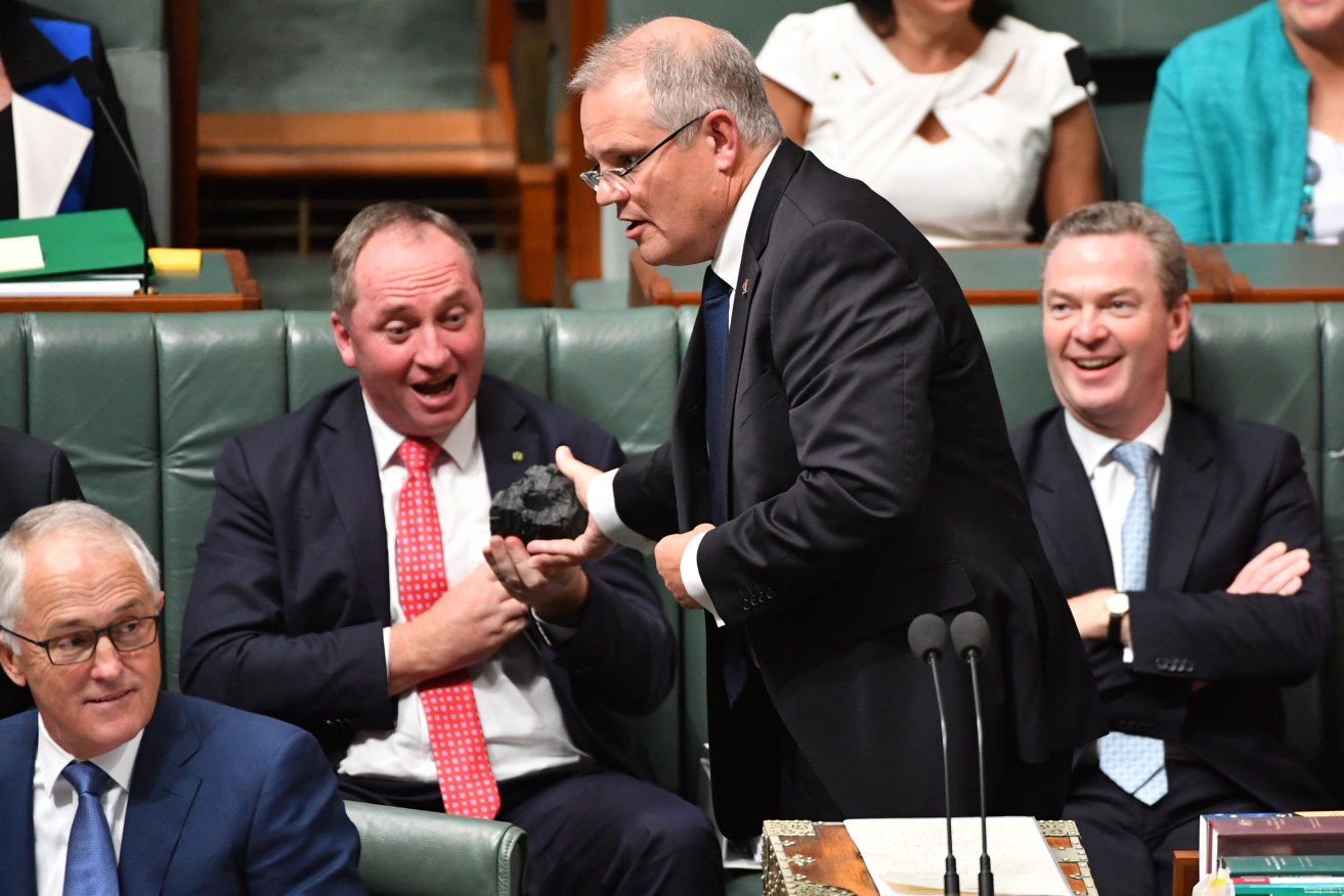 Scott Morrison and Barnaby Joyce with a lump of coal in parliament in 2017. Photo: AAP/Mick Tsikas