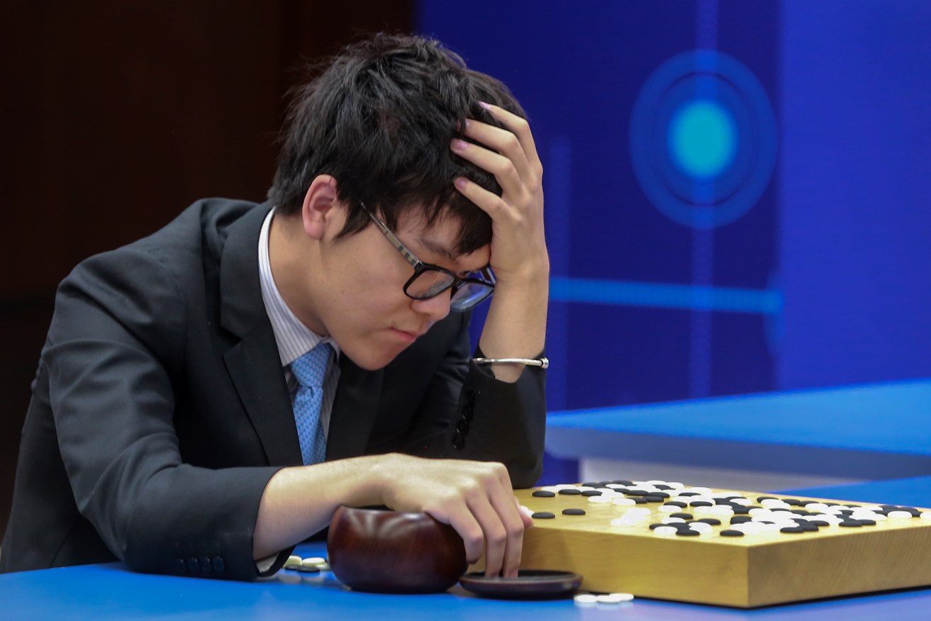 Chinese Go player Ke Jie on his way to defeat against Google's artificial intelligence program, AlphaGo, last week. Photo: Chinatopix via AP