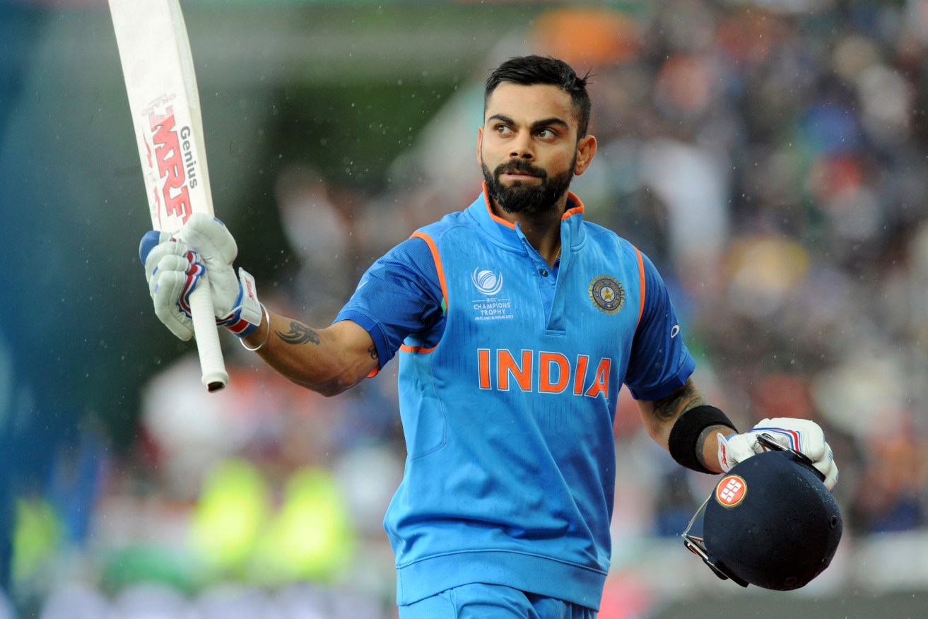 Virat Kohli acknowledges the crowd as he leaves the field at the end of his innings. Photo: Rui Vieira / AP