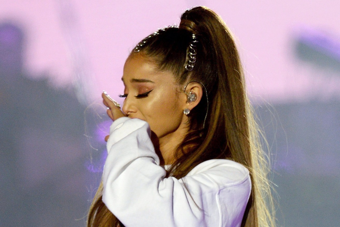 Singer Ariana Grande is overcome by emotion at the tribute concert in Manchester. Photo: Dave Hogan / One Love Manchester via AP