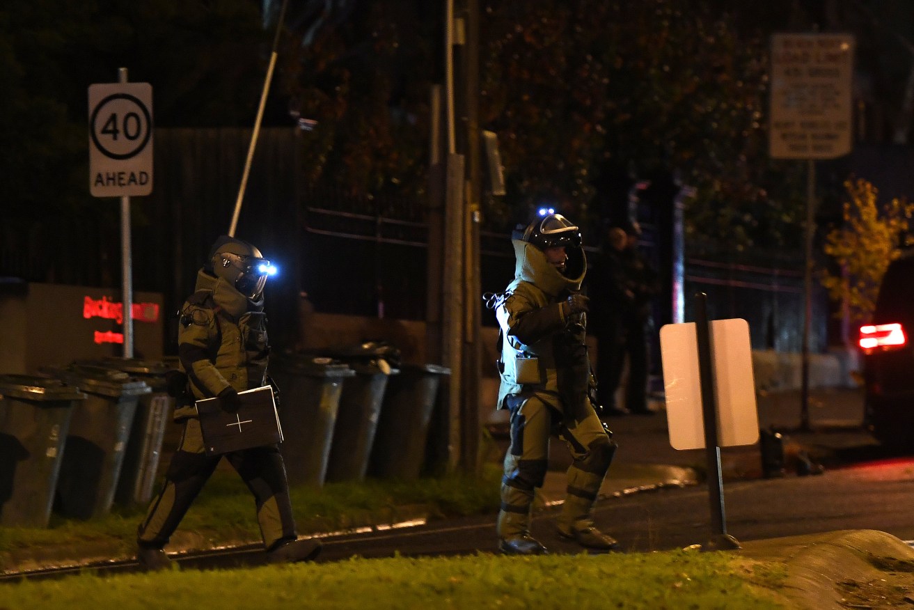 Bomb squad police leaving the Buckingham Serviced Apartments in Brighton on Monday. Photo: AAP/Julian Smith