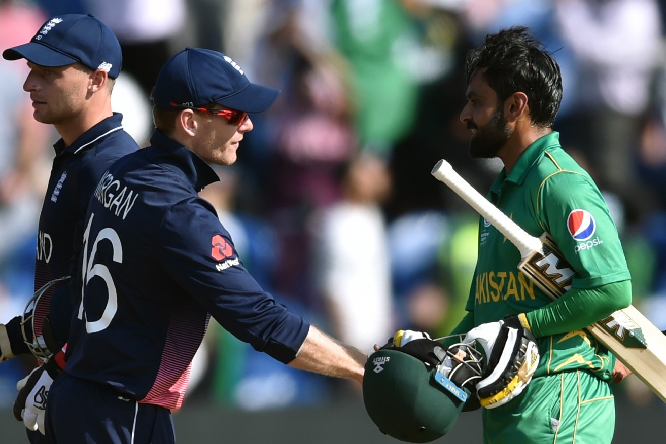England's Eoin Morgan shakes hands with Pakistan's Mohammad Hafeez after the semi-final defeat. Photo: Joe Giddens / PA Wire