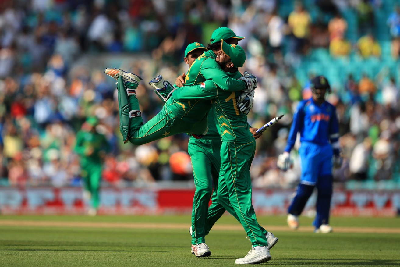 Pakistan's Sarfraz Ahmed celebrates with teammates after catching out India's Jasprit Bumrah to win the ICC Champions Trophy final. Photo: John Walton / PA Wire