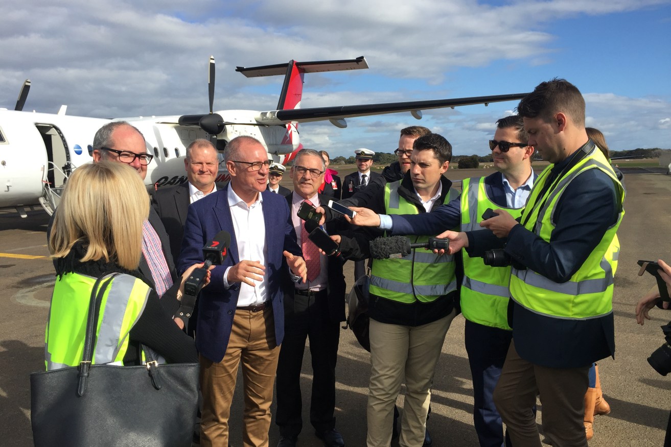 Jay Weatherill fronts reporters on the tarmac at Kingscote.