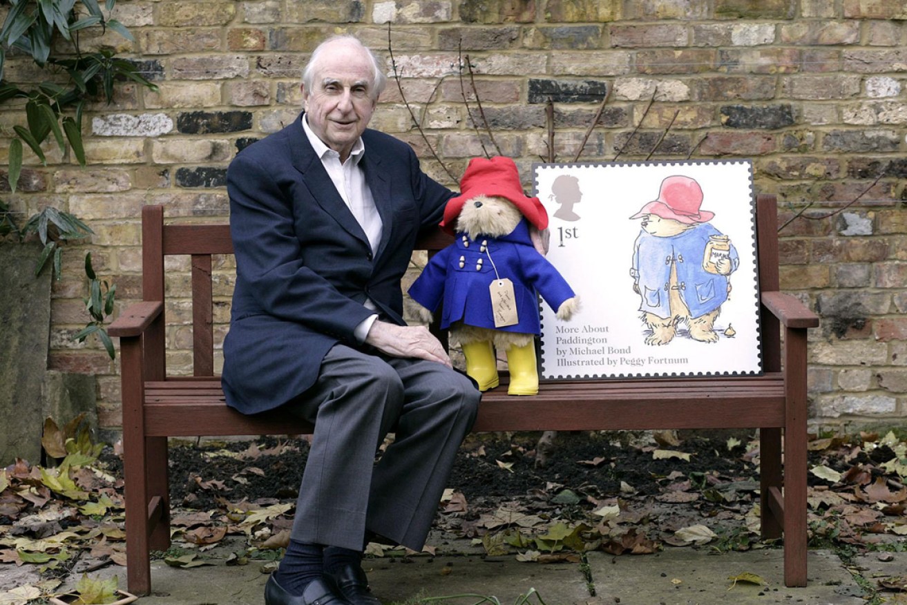 Michael Bond with Paddington Bear in 2006, when he appeared on the Royal Mail's 1st class stamp. Photo: PA