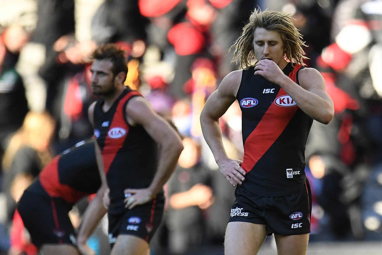 Dyson Heppell and Jobe Watson after the final siren. Photo: Julian Smith / AAP