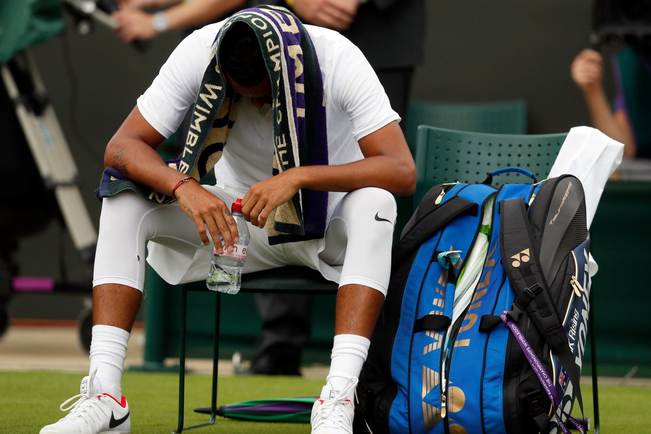 A despondent Nick Kyrgios during his shortlived match against Pierre-Hugues Herbert. Photo: Kirsty Wigglesworth / AP