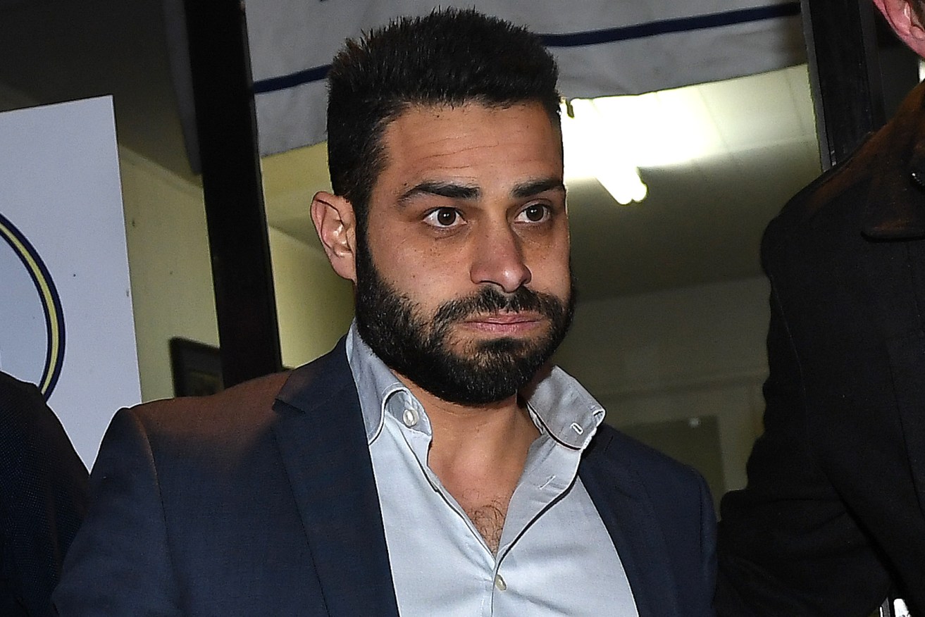 Ali Fahour leaves the Northern Football League headquarters in Melbourne. Photo: Julian Smith / AAP