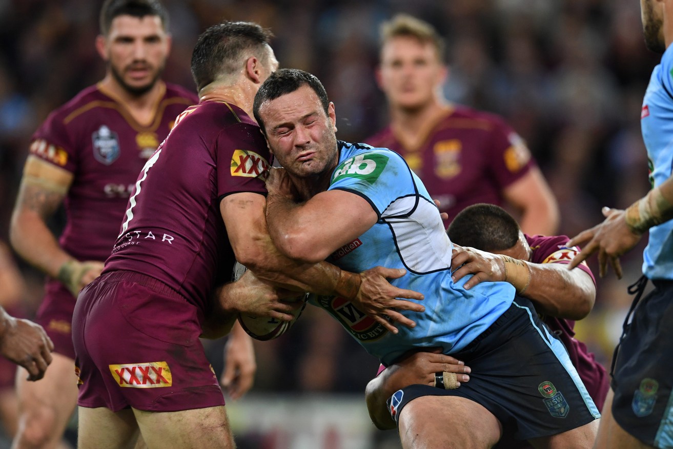 NSW Blues captain Boyd Cordner is tackled during last nights State of Origin decider. Photo: Dan Peled / AAP