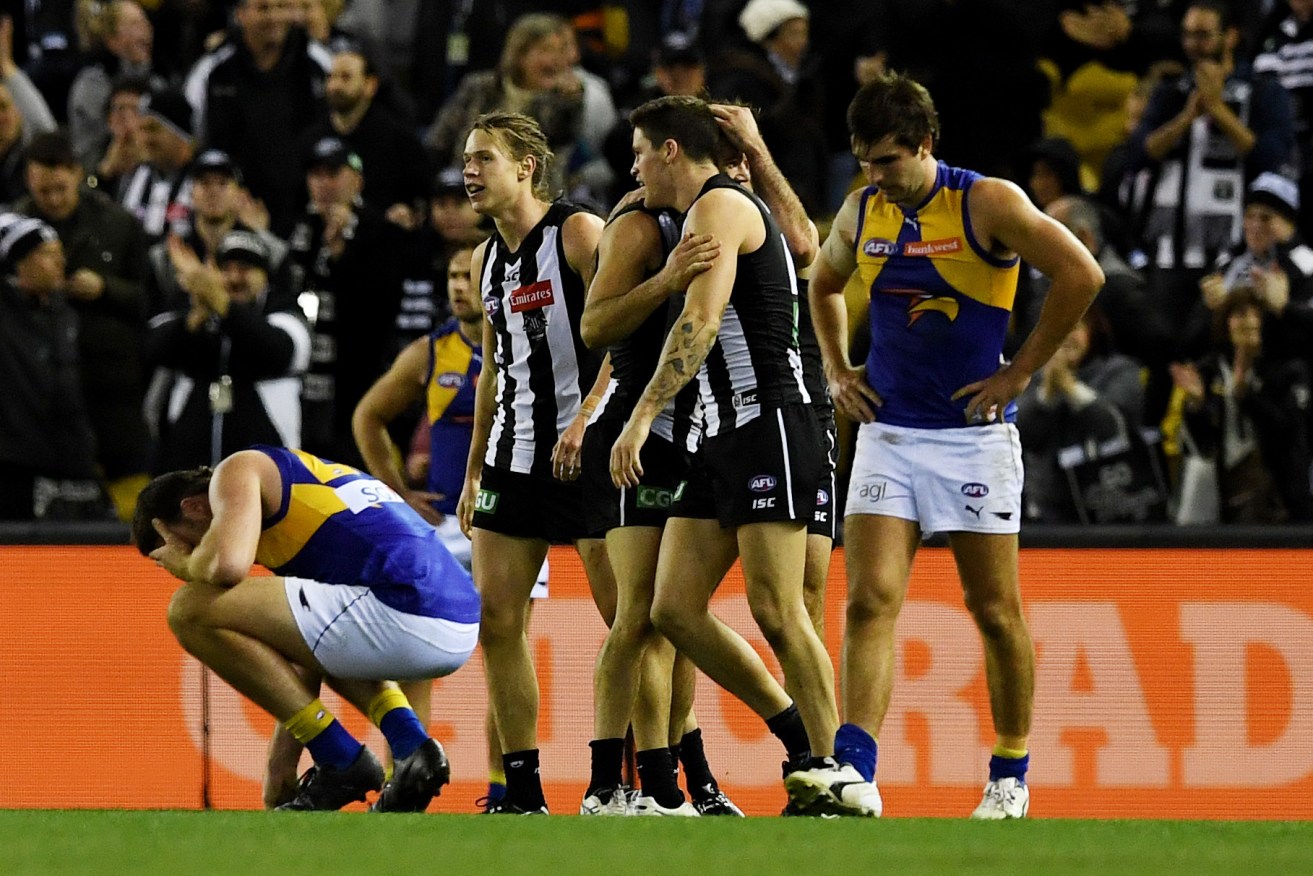 The Magpies celebrate their win over West Coast - but it came at a cost. Photo: Tracey Nearmy / AAP