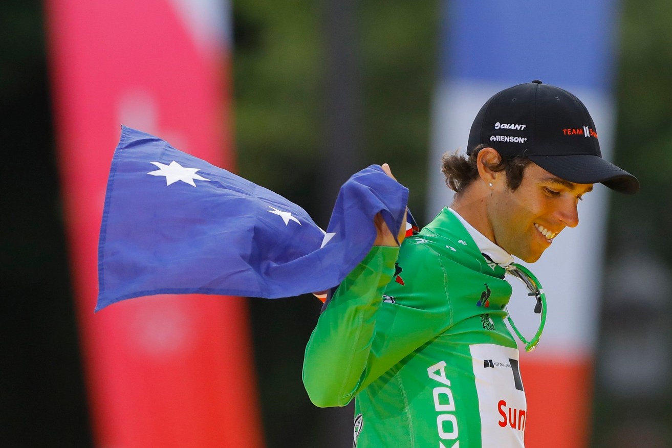 Michael Matthews celebrates winning the Tour de France's best sprinter's green jersey. Photo: ROBERT GHEMENT / EPA