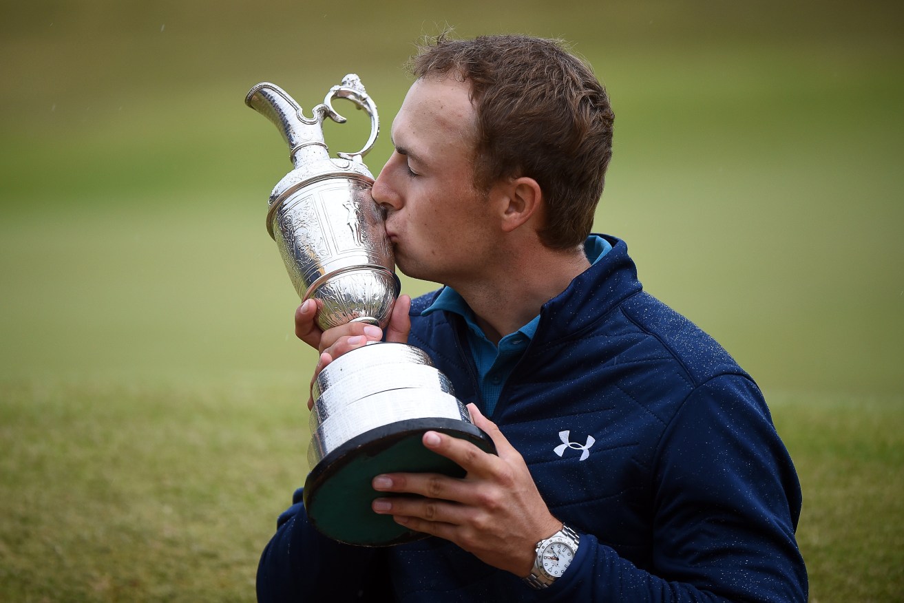 Jordan Spieth kisses the Claret Jug trophy after winning the British Open. Photo: GERRY PENNY / EPA
