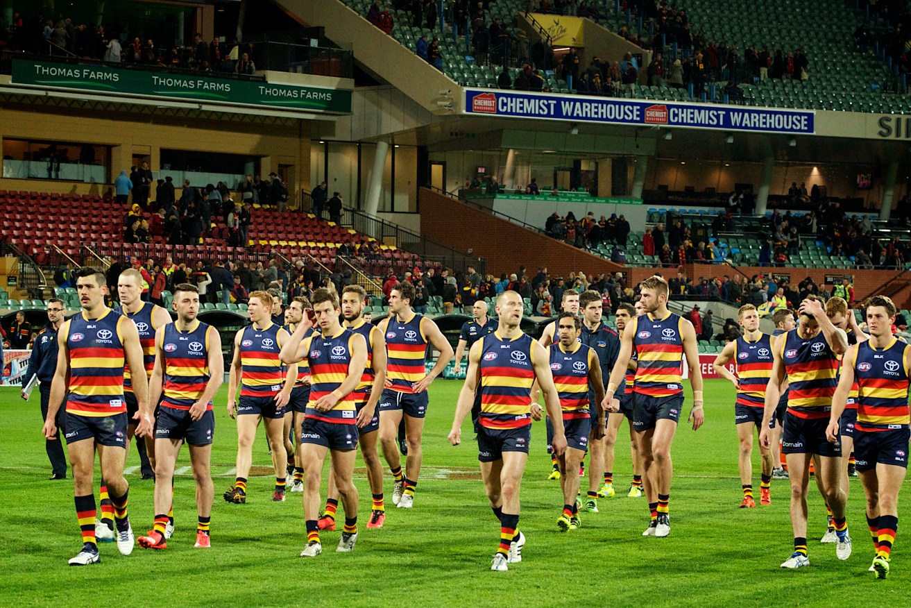 The dejected Crows leave Adelaide Oval after their Round 23 Friday night blockbuster last year. Photo: Michael Errey / InDaily
