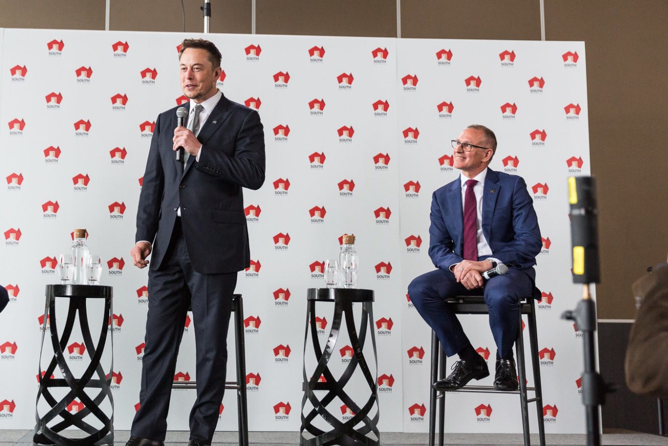 Premier Jay Weatherill watches as tech entrepreneur Elon Musk addresses media at Adelaide Oval today. Photo: Andre Castellucci / InDaily