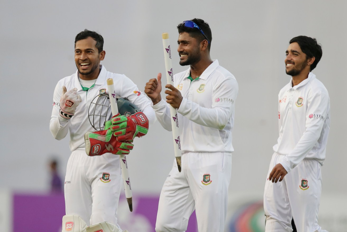 Bangladesh's captain Mushfiqur Rahim, left, celebrates with his teammates Imrul Kayes and Mominul Haque after their watershed Test victory over England last October. Photo: A.M. Ahad / AP