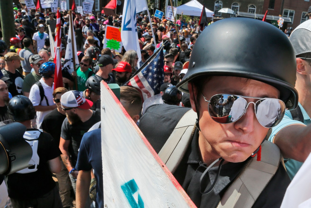 A white nationalist demonstrator equipped with helmet and shield at the rally in Charlottesville. Photo: AP Photo/Steve Helber