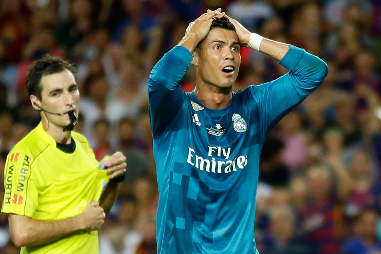 Real Madrid's Cristiano Ronaldo reacts after referee Ricardo de Burgos shows a second yellow card. Photo: Manu Fernandez / AP