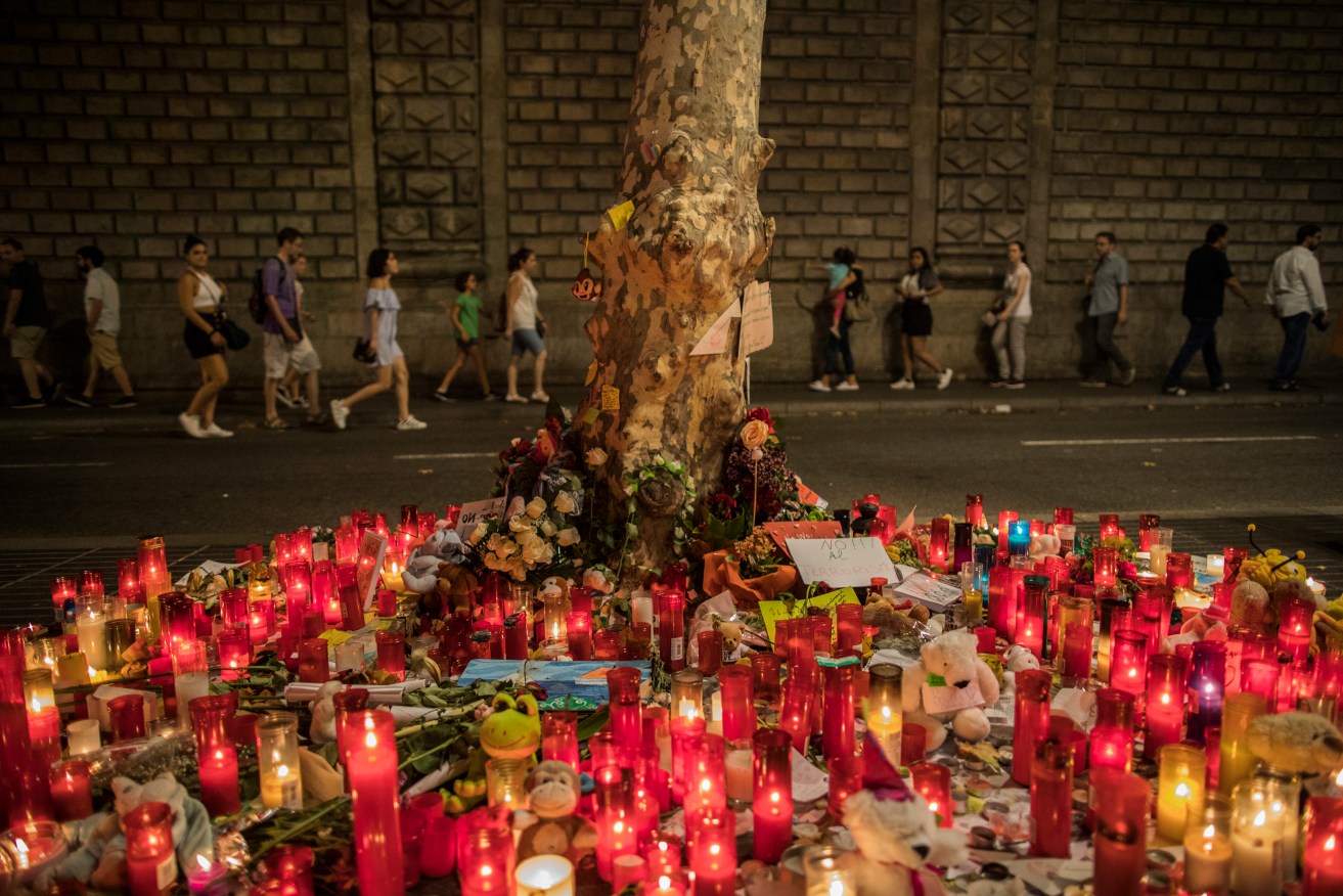 A memorial to the victims of the vehicle attacks on Barcelona's historic Las Ramblas promenade, in Barcelona. Photo: AP/Santi Palacios)