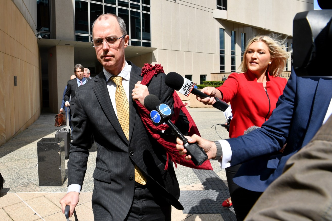 Solicitor-General Dr Stephen Donaghue QC (left), leaves the High Court sitting at the Commonwealth Law Courts in Brisbane today. Photo: AAP/Darren England