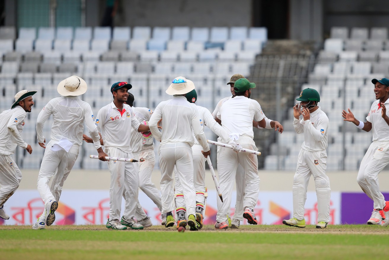 Bangladeshi players celebrate their first Test victory over Australia yesterday. Photo: A.M. Ahad / AP