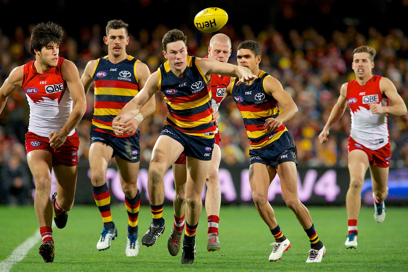 Mitch McGovern and Charlie Cameron, chasing the ball against Sydney last week, are two players whose futures have been the subject of debate. Photo: Michael Errey / InDaily