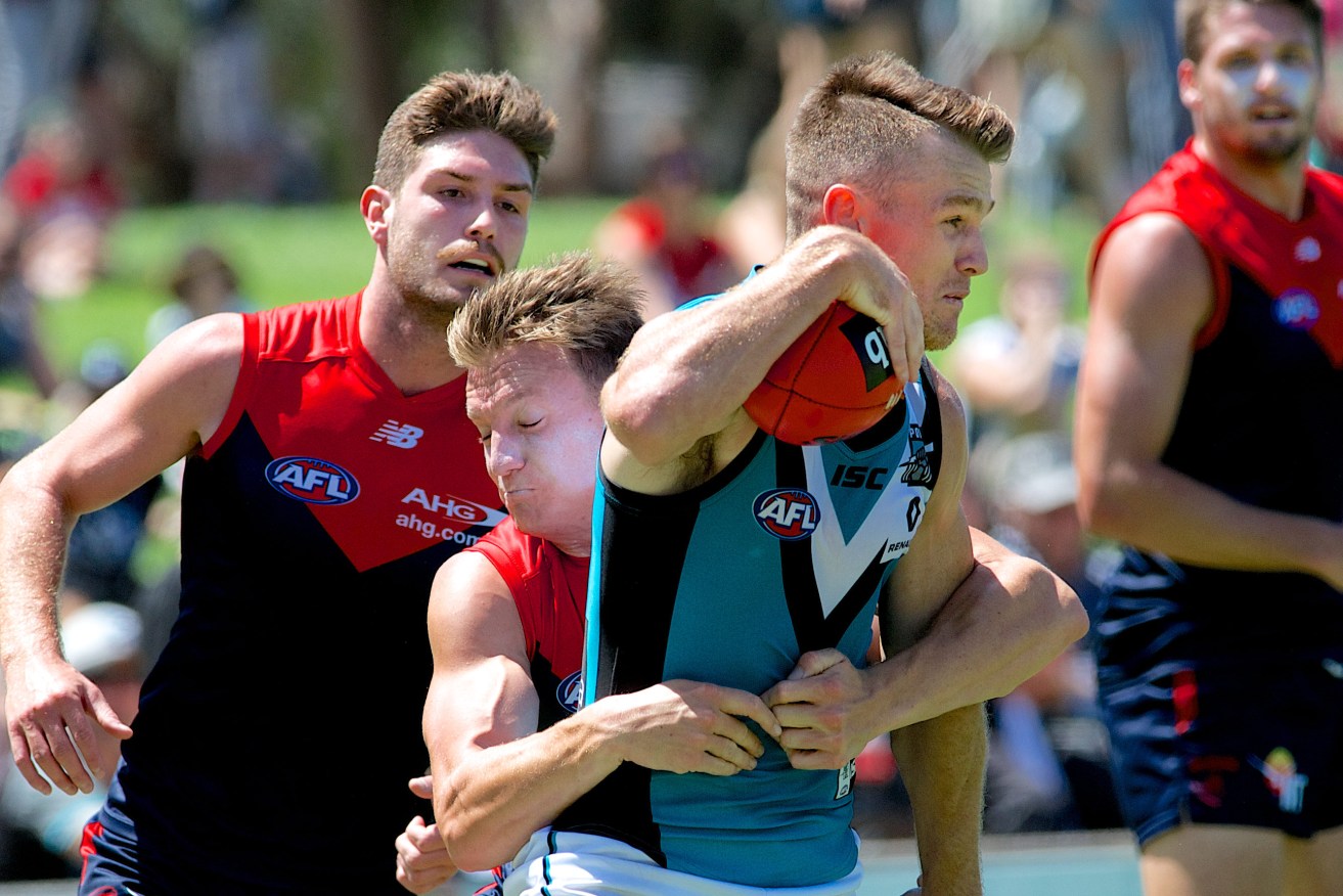 Port Adelaide star Robbie Gray takes a mark during a pre-season match against Melbourne. Photo: Michael Errey / InDaily