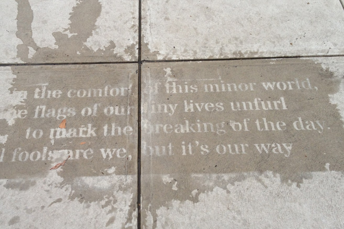A partially exposed Raining Poetry poem -  'This Minor World', by David Burne.