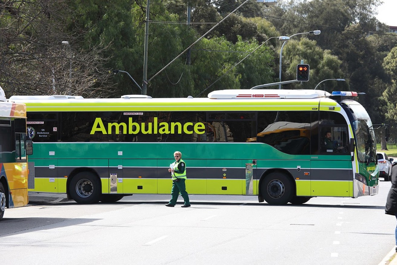SA's "Ambus" ferries patients from the old to the new Royal Adelaide Hospital today. The ambulance workers' union says it's close to negotiating an exemption to the Government's Return To Work provisions. Photo: Tony Lewis / InDaily