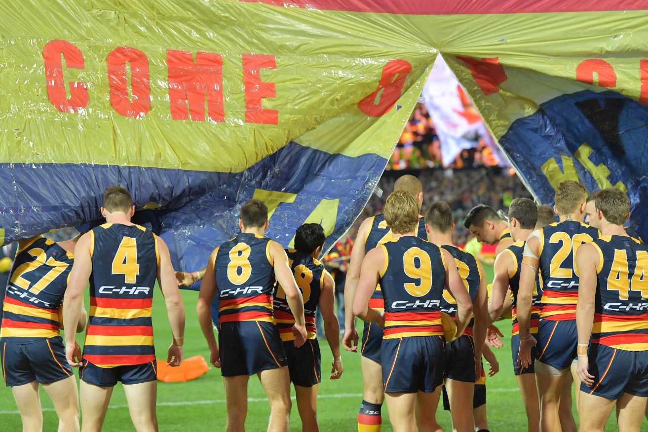 The Crows take the field to play the Cats earlier this year. Photo: David Mariuz / AAP
