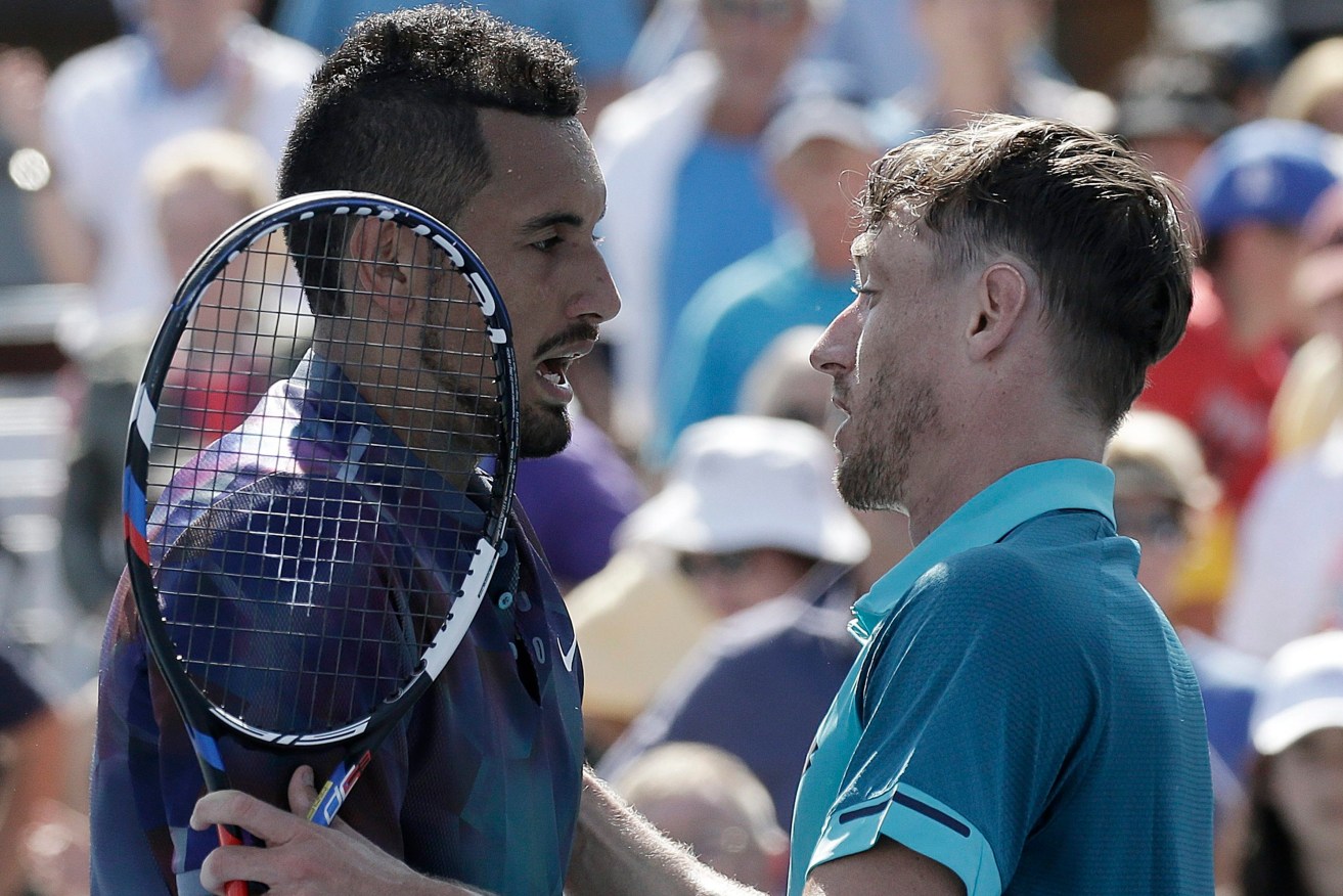 Nick Kyrgios and John Millman share a word after their US Open match. Photo: Peter Foley / EPA 
