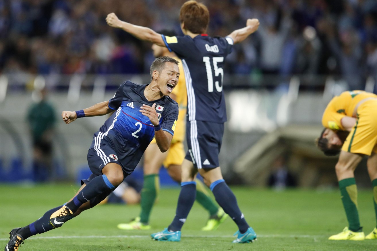 Japan's Yosuke Ideguchi scores his team's second goal against Australia. Photo: Kyodo via AAP
