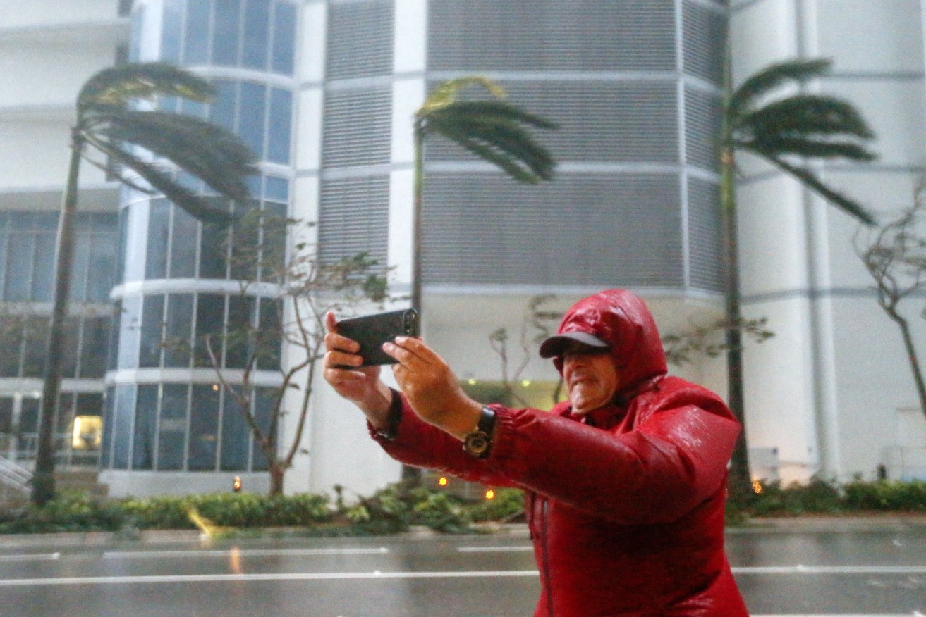A man takes a selfie as the full effects of Hurricane Irma strike in Miami, Florida. Photo: EPA/Erik S. Lesser