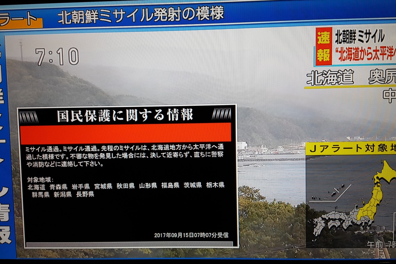 Japanese TV network NHK broadcasts news alerts on  North Korea's missile launch. Photo: Yonhap
